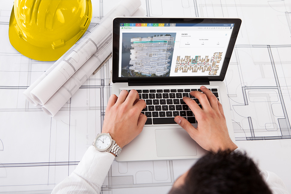A property developer accessing PropSpace on his laptop